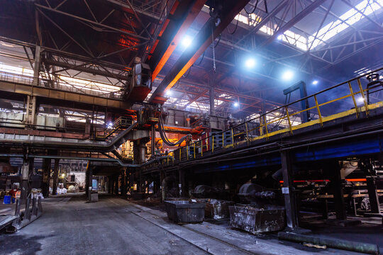 Iron casting at the foundry at metallurgical factory - Powered by Adobe