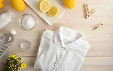 Alternative clothes cleaning products on table with clothes isolated background
