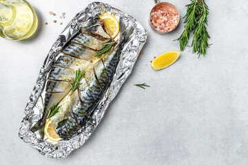 marinated mackerel with spices and herbs ready for baking on a light background, Culinary, cooking concept. place for text, top view - obrazy, fototapety, plakaty