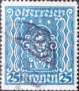 Austria - circa 1922: a postage stamp from Austria, showing a stylized portrait of a woman