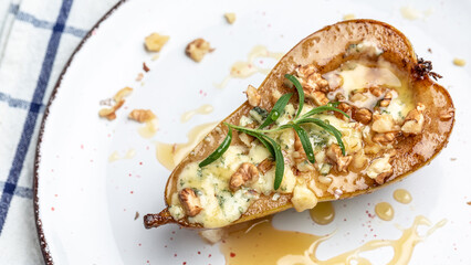 Pears baked with blue cheese, nuts and honey. French cuisine. Keto diet. Vegetarian lunch. Long banner format. top view