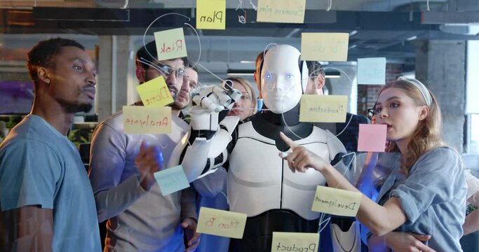 Team of startup planning future tasks in office with humanoid. People and artificial intelligence discussing work and project. Brainstorming meeting. Management strategy. Digital transformation