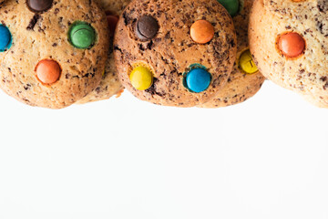 Shortbread cookies with multi-colored chocolate droplets on the white background