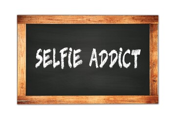 Fototapeta premium SELFIE ADDICT text written on wooden frame school blackboard.