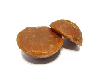Organic palm sugar or Jaggery from India isolated on white background