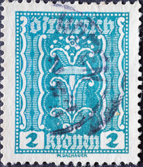 Austria - circa 1922: a postage stamp from Austria, showing a Symbolism: hammer and tongs