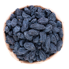 dark raisins in a paper bag on a white background