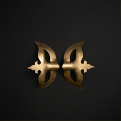 Two metallic gold masquerade masks on black background. Carnival or Masquerade concept.
