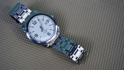 men's watch on brown background