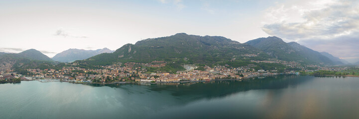 Fototapeta na wymiar Aerial view of Lake Iseo at sunrise,panorama of all the city of lovere which runs along the lake,Bergamo Italy.