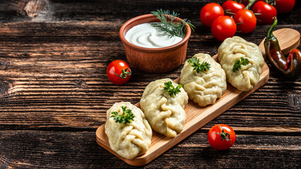 Traditional manti food on plate, top view. The concept of oriental cuisine. Uzbek food manty dumplings. Uzbek food. banner, catering menu recipe place for text
