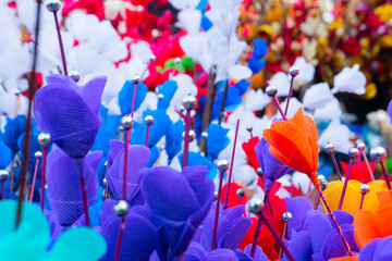 Colorful artificial flowers made out of colored sola, spongewood, handicrafts on display during the Handicraft Fair in Kolkata , West Bengal, India. It is the biggest handicrafts fair in Asia.