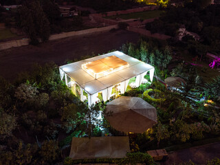 Evening wedding reception, party venue decoration, photo taken with a drone.