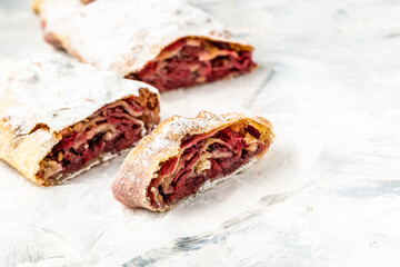 Strudel with a cherry. Cherry pie. winter dessert strudel with cherry, cranberries and walnut