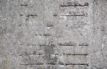 Gray rough concrete wall with rusty reinforcement, background texture