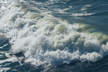 Stormy sea water surface with wave and foam, background photo