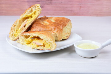 Puff pastry cheese and pineapple cake on wooden background