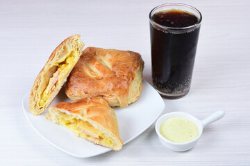 Puff pastry cheese and pineapple cake on wooden background