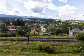 Fototapeta na wymiar Buildings in a settlement in the mountainous Carpathians.