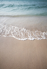 Sand and sea wave. Beach copy space nature background.