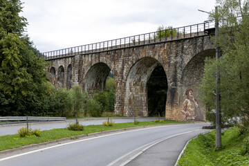Fototapeta na wymiar Old railway arch bridge. Panorama.