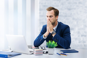 Stressed, astonished, unhappy thoughtful, hard thinking businessman looking at laptop computer, office workplace. Portrait of confident man - business, job and education concept image.