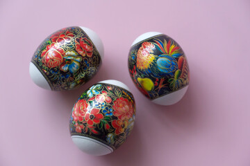 Easter eggs with colorful stickers for decoration. Easter holiday.
