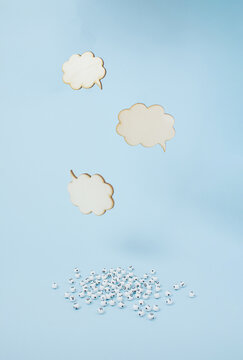 Three cloudy empty conversation box on bright blue background with letters splash on the ground with copy space. Compose your text message. Minimal chat or interview concept. A floating message view.