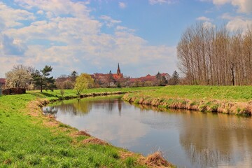 Fototapeta na wymiar A meander of the Svratka river with view to the church at Uhercice, Czech republic
