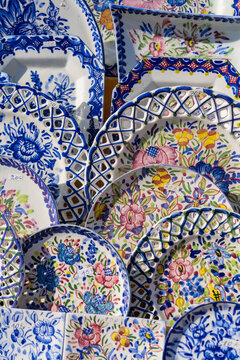 Background with colorful Portuguese blue ceramics, local handicrafts, plates from Porto city.