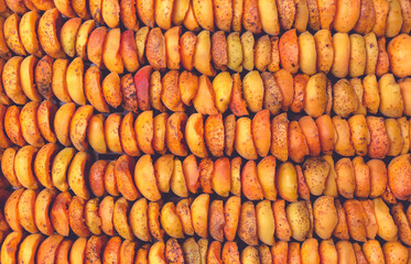 The process of home cooking dried fruits in an electric dryer.
