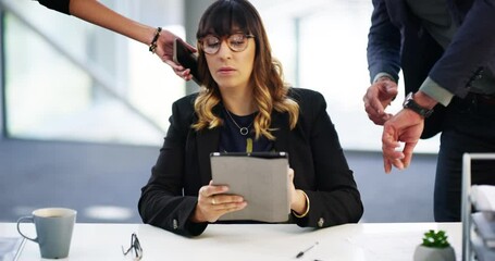 It seems like her work is never done. 4k video footage of a businesswoman looking stressed while being overwhelmed with request from her colleagues in the workplace.
