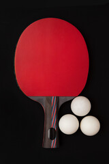 A ping pong racket on a uniform background with a table tennis ball. Free space for text. Sports equipment and ping pong game.