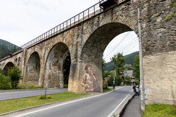 Old railway arch bridge. Panorama.