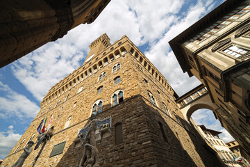 Florence, FI, Italy - August 20, 2015: OLD PALACE called Palazzo Vecchio and replica statue of...