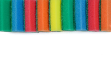Multicolored sponges for washing dishes from above on a white background.Top view