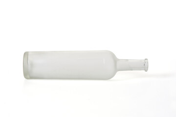 lying down of a opaque glass bottle isolated on white background