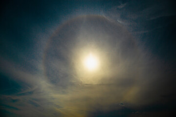 rainbow ring  around sun in cloudy day.Fantastic Natural solar effect. 
 Beautiful diamond dust...