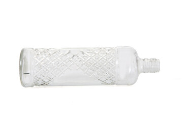  lying down of a glass bottle with textured diagonal stripes isolated on white background