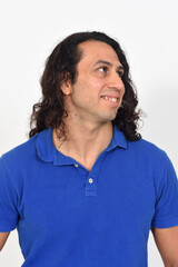 portriat of a man with long hair looking up on white background