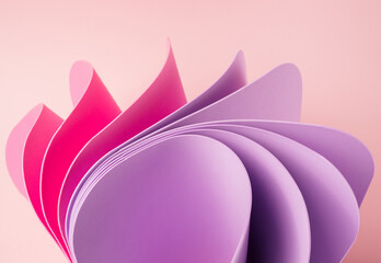 Pink and violet abstract shapes on a pastel pink background. Elegant soft backdrop.