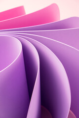 Purple and pink curved sheets abstract wallpaper. Elegant pastel background.