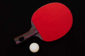 A ping pong racket on a uniform background with a table tennis ball. Free space for text. Sports...