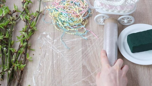Instruction, step by step. Step 2 of 7. Stylish DIY home decoration. We place a damp floral sponge in the film