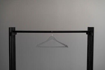 simple single clothes hanger on the rack, abstract simple fashion concept