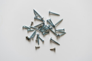 top view of a lot of new self-tapping screws flat lay