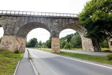 Fototapeta premium Old railway arch bridge. Panorama.