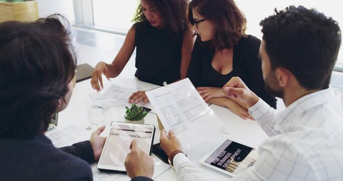 Not just on target, weve exceeded it. 4k video footage of a group of young businesspeople having a meeting.