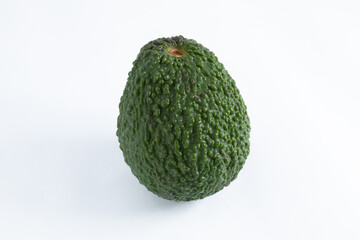 Nutritious and healthy avocado, whole and raw, with wrinkled and green skin