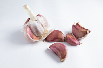 Garlic head partially threshed. Aromatic seasoning for savory meals.